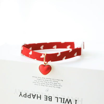 Red collar with a heart tag. 